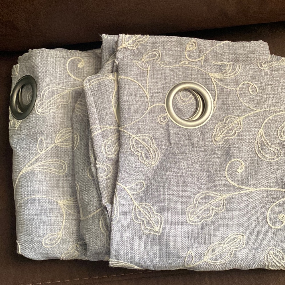 Light blue/gray embroidered curtains. Light weight.